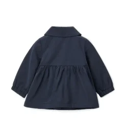 Trench con fiocchi