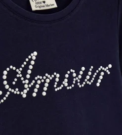 T-shirt blu con perle